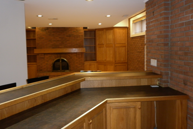 View from Kitchen into Living Room - Luxurious, high-ceiling 1 bdrm basement apartment in Little Italy/Blood Dovercourt