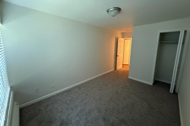 The room for rent. Now contains a bed, table and drawer. - $900 Apartment, looking for one roommate
