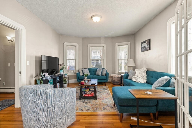 Living Room - Renovated 2 Bed, East Watertown, free in-unit laundry Apartments