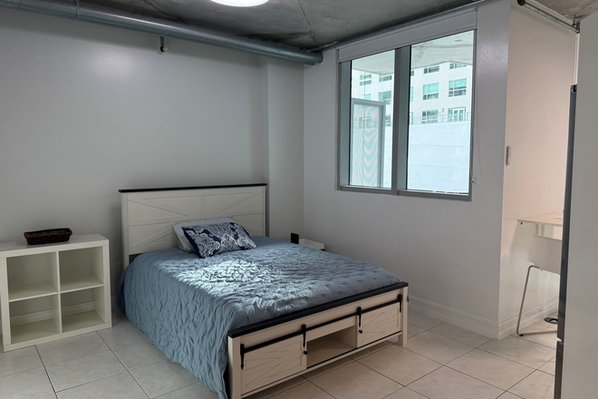 Bedroom area is next to bathroom, washer dryer are located in the bathroom - Updated loft apartment near train & mall