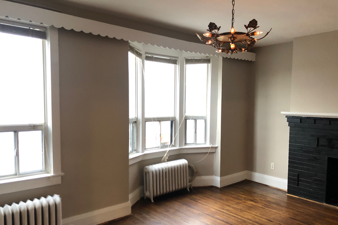 Main living room facing Danforth Ave - 2 Bedrooms, 1 Den (or 3rd bedroom) in the Danforth Neighbourhood 1 block from subway Apartments
