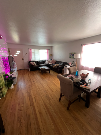 Large living room with big tv, couch and nice dining table. - BPM house