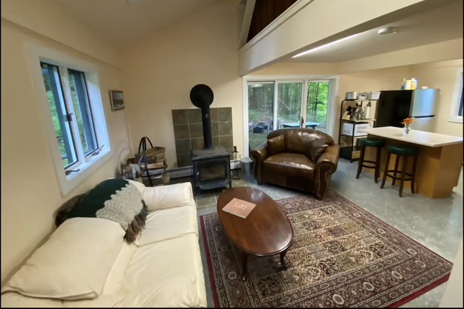 First floor seating area and wood stove. - House w Mountain Views near campus