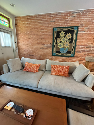 living room off front door - Little Italy In-Law Suite in large fully renovated row house w/ parking pass - short or long term