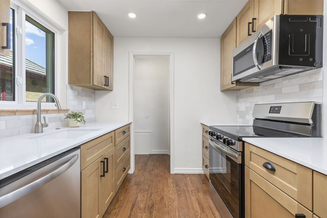 Fully Renovated Kitchen. Brand new cabinetry, quartz countertops, and all new appliances. - Renovated Denver Home for Rent in Park Hill neighborhood. 15 mins to CU Anschutz & Children's.