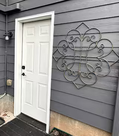 Door to unit - Cozy with all the Amenities Apartments