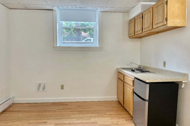 Kitchen - Available Now – Sunny Beacon Street Studio with Hardwood Floors Apartments