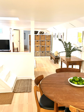 Dining, through to livingroom - Beautiful minimalist one-bedroom suite in leafy Dundas West/Little Portugal House
