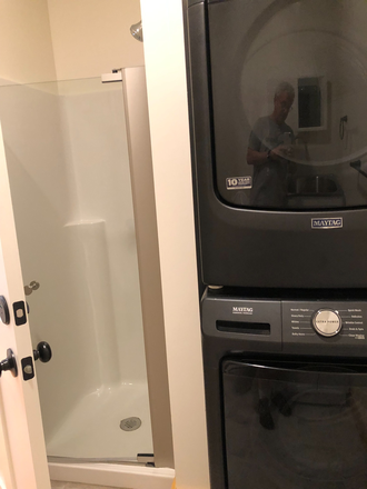 Bathroom shower & laundry - 2nd Floor Studio Apartment
