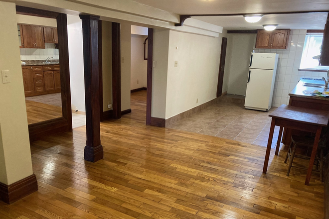 view of kitchen and rear exit - Bright and Spacious 1 Bedroom Basement Apartment in Little Italy