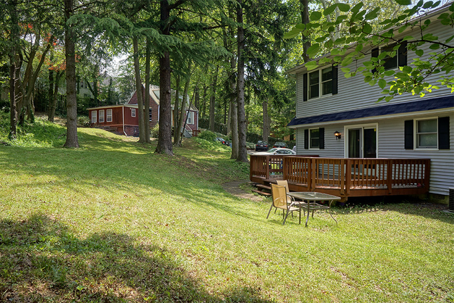 Front Yard and Neighboring House - 4-Bedroom, 2 Bath 1 mile from University, Forest Setting House