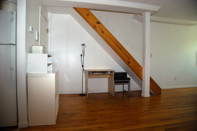 Side view of the staircase and built-in desk nook in the living room. - 1 Year-Harlem Sublease 2 bed/ 2 bath Apt: Sep 2026-Sep 2027