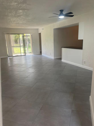 Kitchen and living - 3/2 WINDWOOD Lakefront Nature Preserve First Floor Condo Newly Renovated with Luxury Finishes