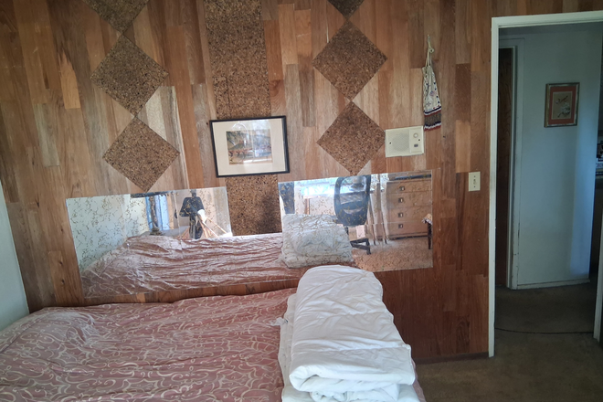 Bedroom - Furnished bedroom with shared bath in private home with canyon view.