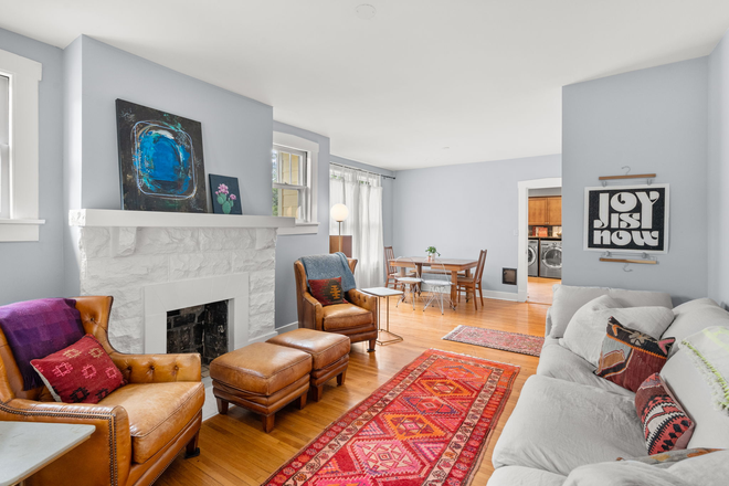 A comfortable sofa in an open floorplan home. - Restful Home in Hillsboro Village, Walk to Vanderbilt