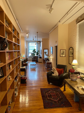 Living room and library - Fully furnished room in prime soho location walkable distance to NYU Apartments