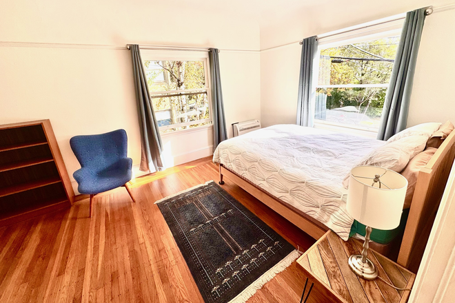 Bedroom of rental unit - Bedroom with attached, private living room and office in home shared with owner