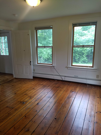 Bedroom showing hardwood floor - Beautiful Unit close to UCONN