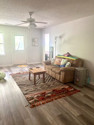 Living Room - Seeking Female Roommates -Room with Private Bath at University Glen -Steps from NC State Condo