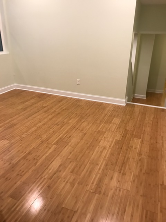 Living Room - Economical Room for rent with in-unit laundry, central air/heat & walking distance to campus Apartments