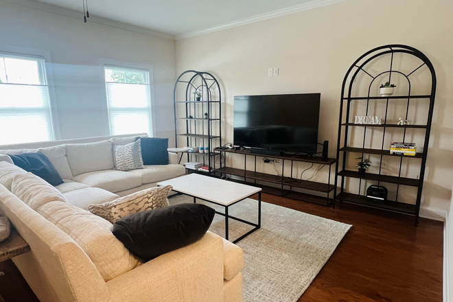 Living Room - Large primary bedroom w/private bathroom available in luxury furnished townhouse including utilities