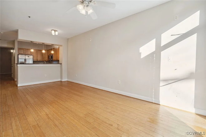 Living Room, Kitchen, and Entrance Hallway - Iron Place Condominiums