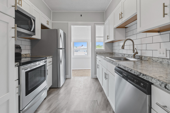 Kitchen - STUNNING 7 Bedroom w/ parking, multiple porches & huge unfinished basement! Apartments