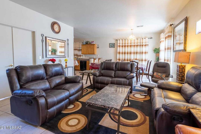 A spacious multi-story home floor plan featuring a kitchen, two distinct living rooms, and 3.4 bathrooms. - Elijah House