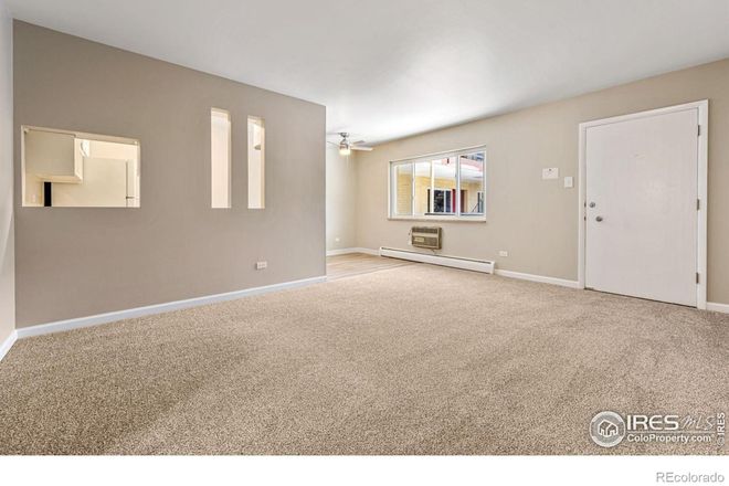 Entry to living room - Tired of roomates? Updated one bedroom condo, 1/2 block to campus, mountain views!