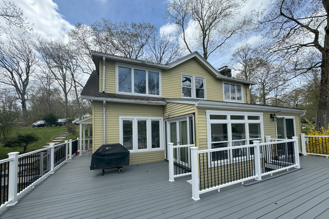 Rear house and NEW deck - Coventry Lake Front Rental 1st FL Duplex