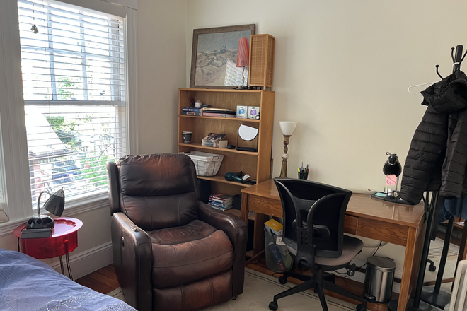 Comfortable armchair and large desk - Furnished Room Available Now Near Harvard & Red Line Apartments
