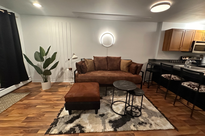 Couch that converts to a twin bed for guests - West Village 3 Condo