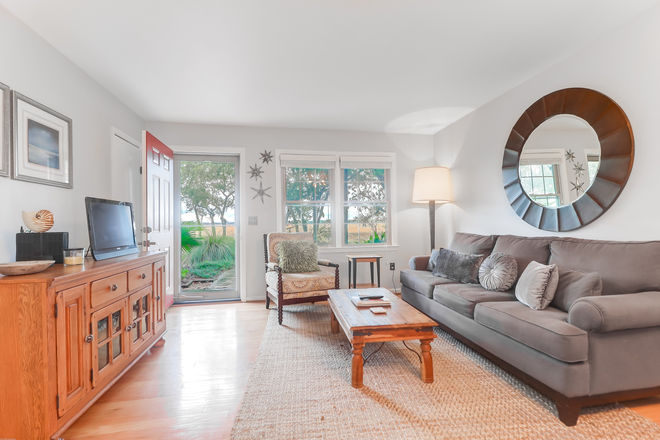 Living Room - Private 2-Bedroom End Unit Condo with breathtaking marsh views conveniently located in West Ashley