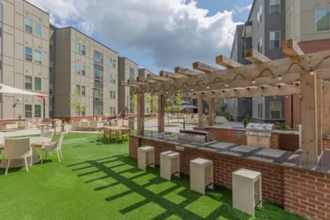 photo of the sitting area as well as barbecue around the pool - The Union Blacksburg