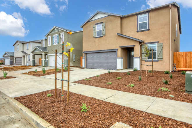 3 Street-angle exterior showing neighborhood context - 5 Bedrooms / 3 Bathrooms ENTIRE Brand-New Home Near UC Merced— Solar +Tesla Powerwall + 2-Car Garage