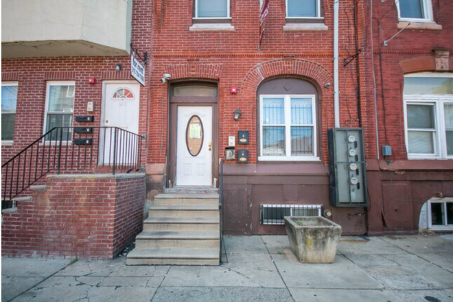 outside of the unit. The unit is the first floor of this house. - first floor of a townhouse.