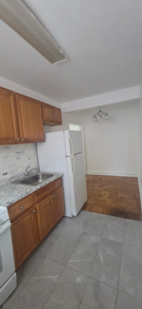 Kitchen with view of dining room - 5061 NEW HAMPSHIRE AVE NW: SPACIOUS & BRIGHT 1 BR IN PETWORTH Apartments