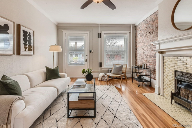 Large, cozy living room with charm, plus a large balcony. - Bright, Spacious and Beautiful Denver Apt Close to Cheesman Park, Capitol Hill & City Park