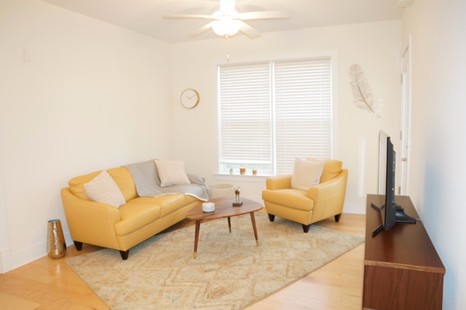Living Room - McIntire Plaza Apartments