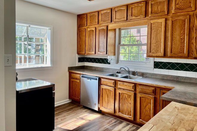 Kitchen - Charming 4BR/2BA brick home with arched entryway located one block from DU. Available Sept 1, 2025