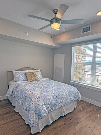 Bedroom with mountain views adjacent to patio - Reduced Rent for Lease Takeover / Sublet in New Luxury 1 bed/ 1 ba Apt