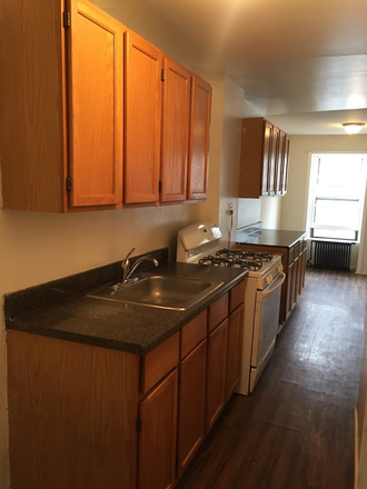 galley kitchen - Bedford Stuyvesant Sunny Landmark Brownstone Apartment Top Floor