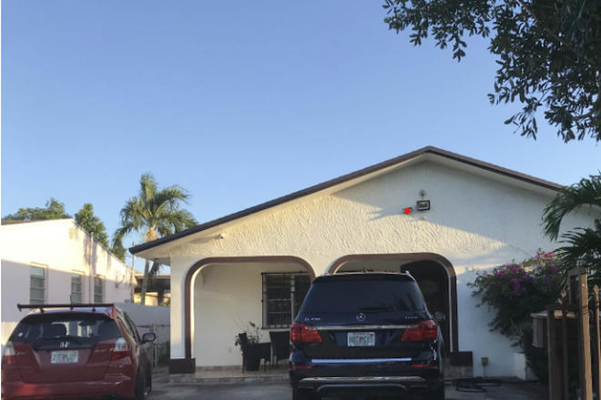 Outside street view of the home - Efficiency with 2 rooms, a bathroom, and small kitchen House