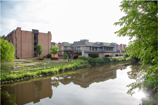 Exterior of Cedar Village Community from Bouge St. Bridge - Cedar Village Apartments