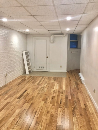Visit hubrealtyproperties.com - Top location,  furnished studio, basement level, near HMS and Saint Mary's T stop
