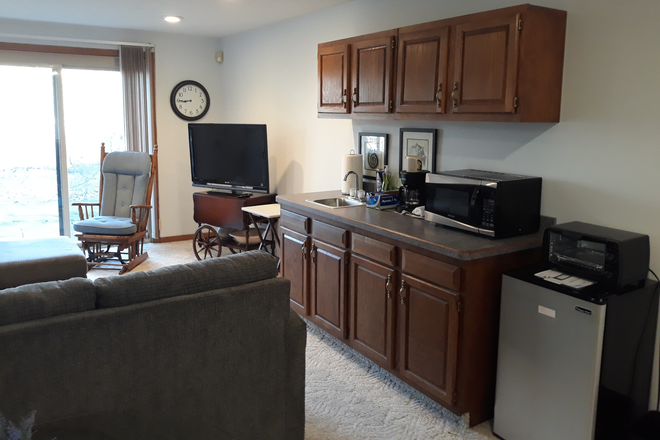 living area with mini-kitchen - Close to MSU, Emerald Lakes neighborhood, near Burcham & E. Hidden Lake Dr. Condo