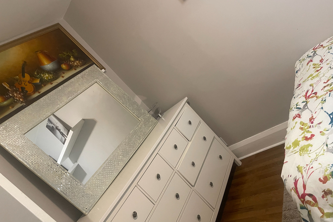 The first-floor bedroom includes a double bed, study desk, and chair. - Quiet Toronto Home – Private Upstairs & Basement Rooms