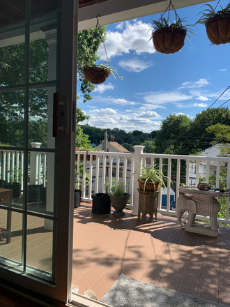 a deck overlooks the garden - private room for female roommate, with shared bath, kitchen access in family residence / util incld House