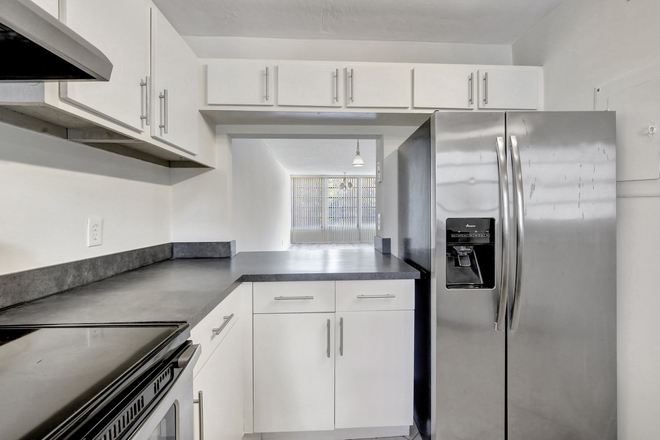 Kitchen with stainless steel appliances - 2/2 condo in Live Oak at Pine Island Ridge, 10 min to campus