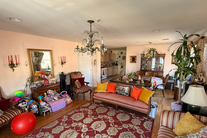 Living room toward dining and open kitchen area (identical apartment) - Spacious beautiful 3 bedroom with quick commute to Manhattan Apartments